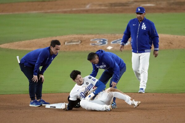 大谷正平在世界大赛第二场比赛中左臂滑到二垒受伤，伤势不确定